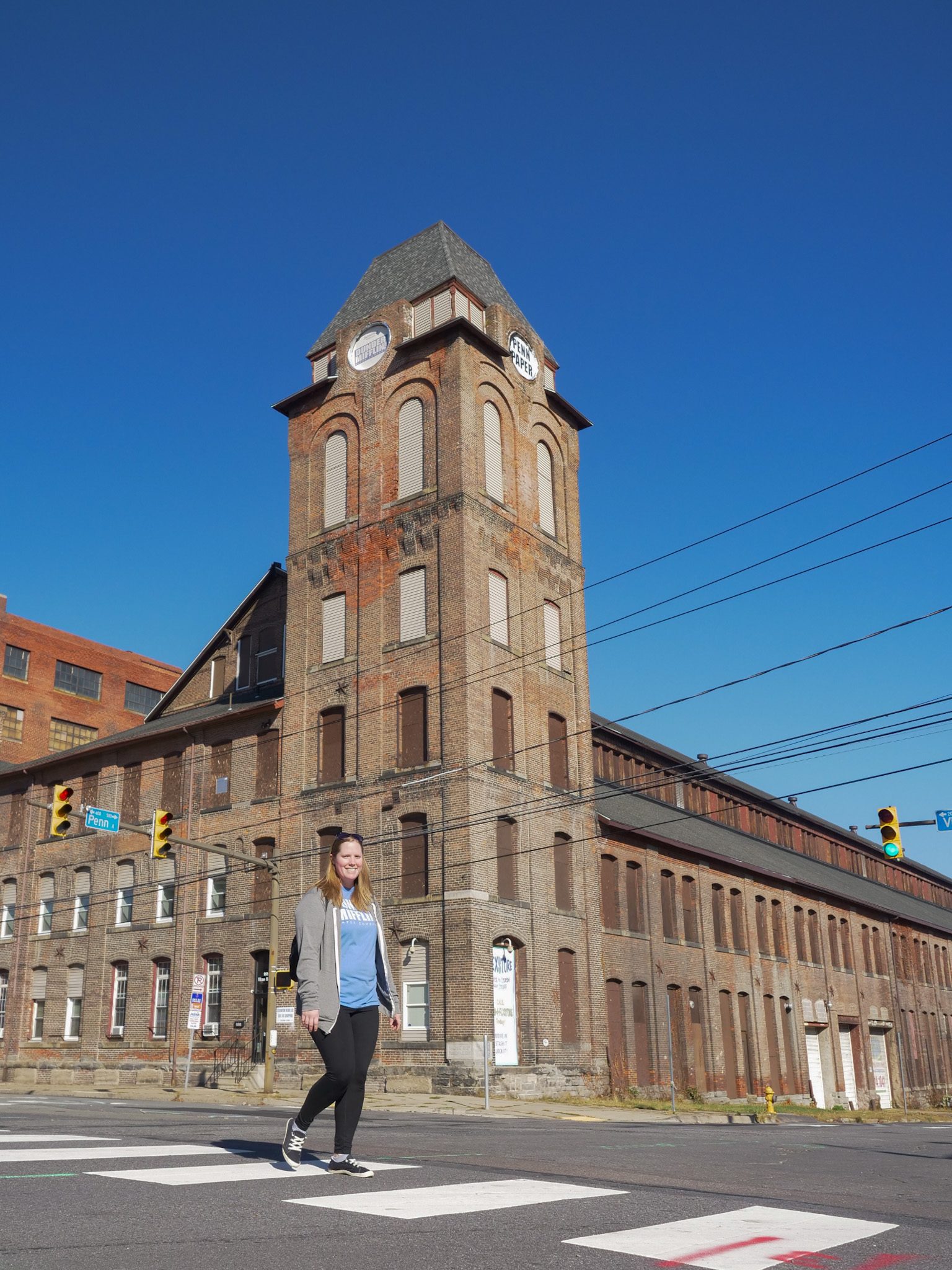 Emily walking in front of Penn Paper Tower | Traveling Twogether